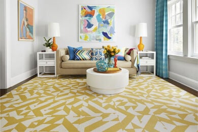 FLOR Twisted Spokes living room area rug shown in Maize