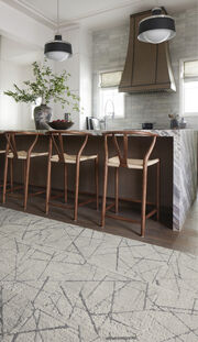 Bar stools in Kitchen area featuring FLOR Chasing Pavement area rug shown in Chalk/Silver.