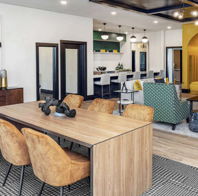 Open concept conference seating area showing FLOR Collins Cottage area rug in Charcoal