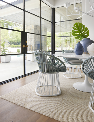 Dining room with FLOR Hit The Road area rug shown in Bone