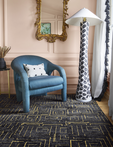 Chair with FLOR Gatsby area rug shown in Flint/Gold