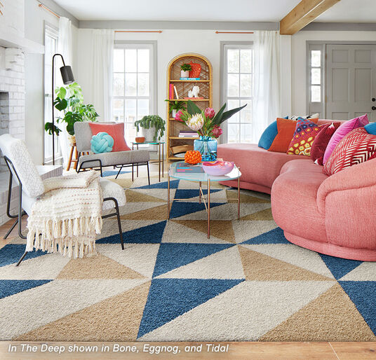 Living room seating area with FLOR In The Deep area rug shown in Bone, Eggnog, and Tidal