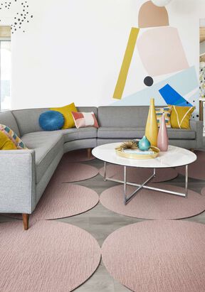 Seating area with multiple Made You Look Round Rugs shown in Blush