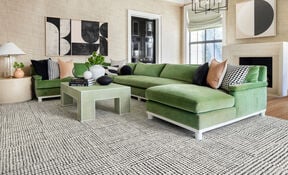 Modern living room with FLOR Penny For Your Thoughts area rug shown in Black