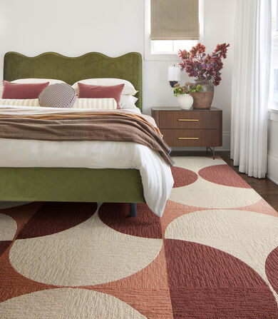Bedroom with custom Made You Look rug in Pearl, Coral, and new Mauve