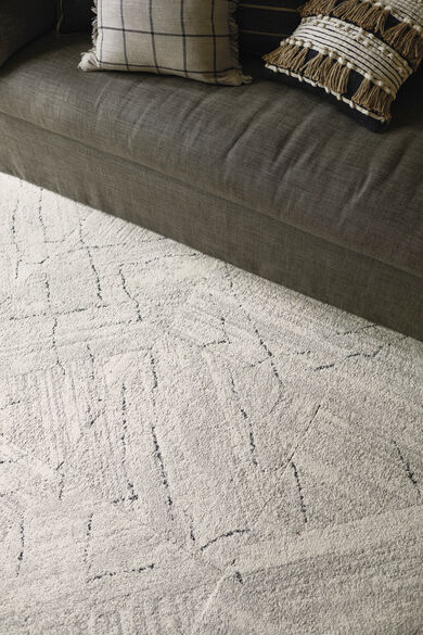 Detail shot of FLOR Trade Winds area rug shown in Bone