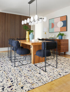 Modern dining room with FLOR Painter's Palette area rug in Lichen