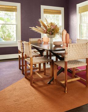 FLOR Made You Look dining room rug shown in Pearl, Berry, Copper, and Lavender