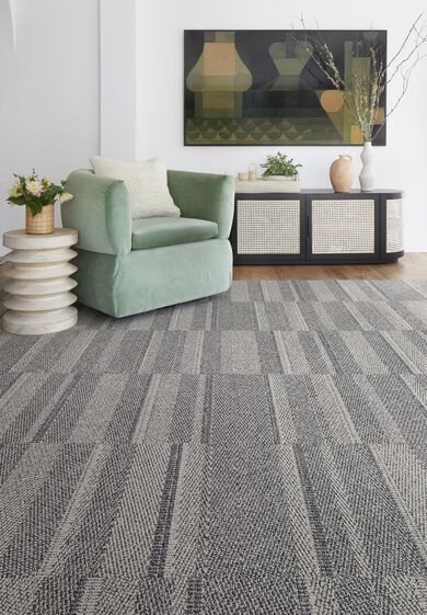 Sitting area with NEW FLOR One Liner area rug shown in Chalk/Mica