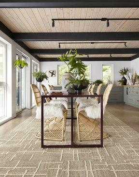 Dining room with FLOR Draper area rug shown in Topaz