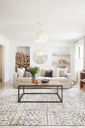 Bright living room with neutral palette featuring FLOR Foothills shown in bright white