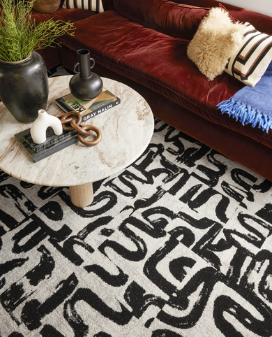 Living room with FLOR Scenic Route area rug shown in Chalk/Black