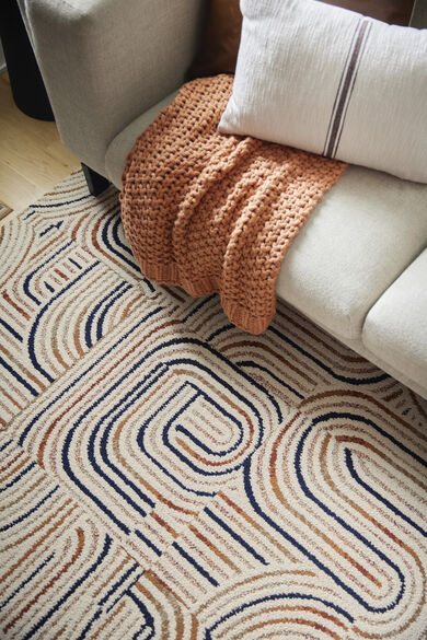 Detail shot of NEW FLOR Leaps And Bounds area rug shown in Saddle