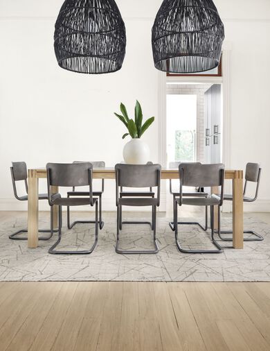 Dining room with FLOR Chasing Pavement area rug shown in Chalk/Silver