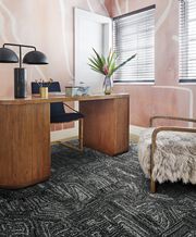 Home office with pink walls and FLOR area rug Anthracite shown in Flint/Silver