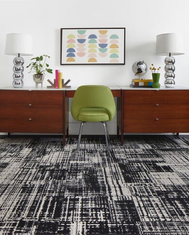 Desk with FLOR Dappled Daylight area rug shown in Black