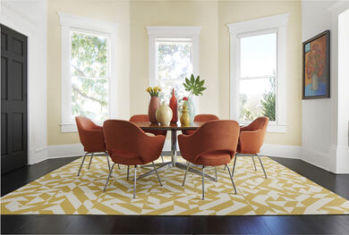 Dining room shown on top of FLOR area rug Twised Spokes shown in Maize