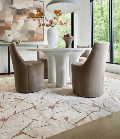 Dining area with FLOR Across The Web area rug shown in Bone/Saddle
