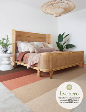 Bedroom with FLOR Made You Look area rug shown in Pearl, Tawny, Coral, Spice, Mahogany, and Bark
