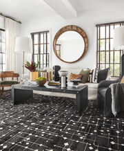 Sitting area with FLOR Hollin Hills area rug shown in Flint