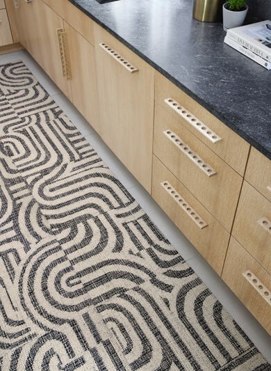 Kitchen Aisle with FLOR Around The Bend area rug shown in Pearl/Flint