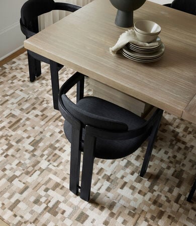 Dining area with FLOR Lost In Pixels area rug shown in Bright White/Bone