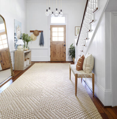 Entryway with FLOR Roadside Attraction area rug shown in Haze