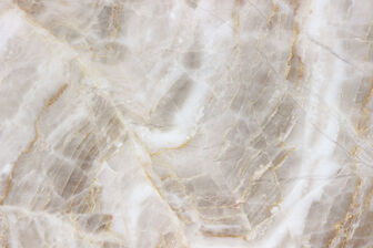 Close up view of white marble with gold veins. 