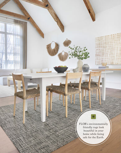 Dining room with nature accents with FLOR London Twill area rug shown in Flint/Pearl