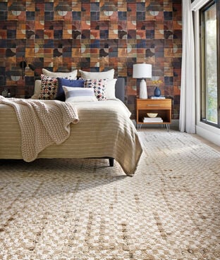  Graphic and cozy bedroom with FLOR Check It Out area rug shown in Pearl