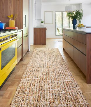 Vibrant kitchen with FLOR Tailored Touch runner rug shown in Clementine