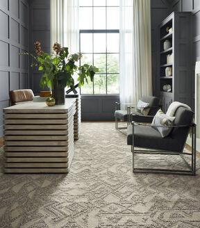FLOR Beck And Call office rug in Pearl with a light wood desk and gray chairs. 