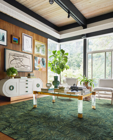 Living room with FLOR Palm Reader area rug shown in Kale