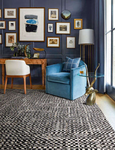 Moody study with gallery wall and FLOR Check It Out area rug shown in Black