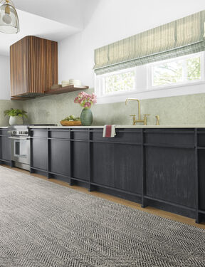 Kitchen area featuring FLOR area rug Open Invitation shown in Mica.