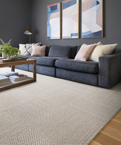 Living room with FLOR area rug Hit The Road shown in Bone