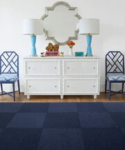 Dresser with lamps and FLOR Heaven Sent area rug shown in Indigo.