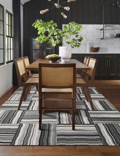 FLOR Off The Record area rug in dining room shown in Black