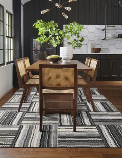 FLOR Off The Record area rug in dining room shown in Black