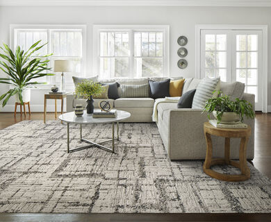 Living room with FLOR Natural Fit area rug shown in Grey.