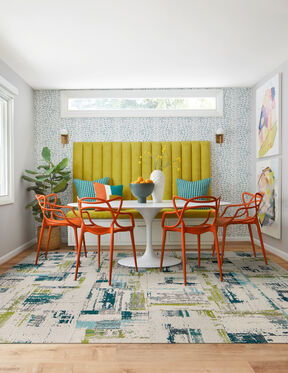 Breakfast nook area with FLOR Splish Splash area rug shown in Teal