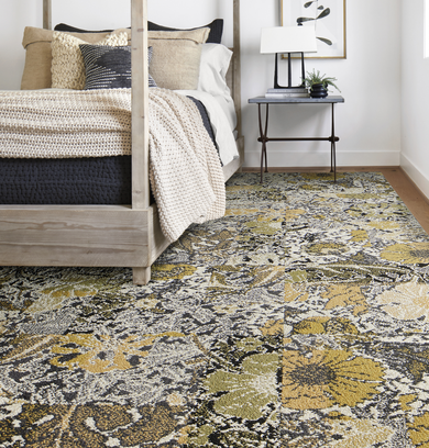 Bedroom area with FLOR Among The Wildflowers area rug shown in Palm