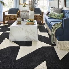 Contemporary living room with FLOR Signature Rug Mermaid Braid shown in Black
