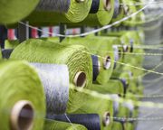 Cones of green yarn.