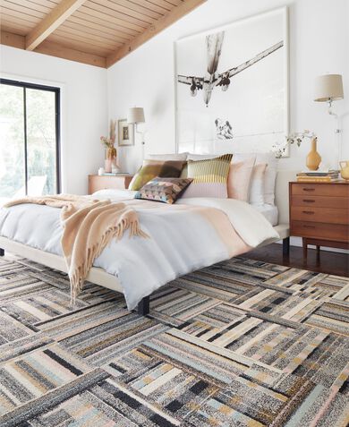 Bedroom area rug shot showing FLOR Better Half in Blush