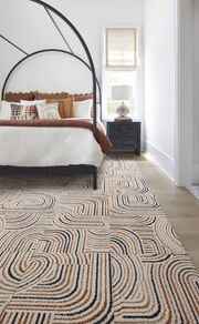Bedroom with NEW FLOR Leaps And Bounds area rug shown in Berry