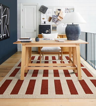 Home office on loft balcony with FLOR Made You Look area rug in Pearl and Spice