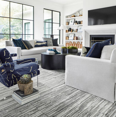 Living room with FLOR Fully Barked area rug shown in Frost